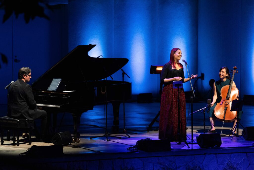 Francesco Turrisi, Rhiannon Giddens, Karen Ouzounian on the stage of Libbey Bowl, all smiling