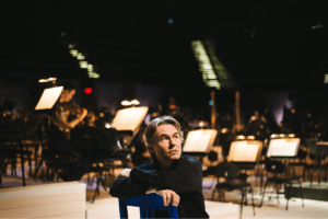 conductor/composer Esa-Pekka Salonen sitting