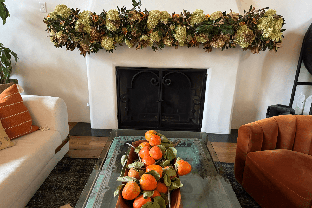 fireplace with floral arrangements