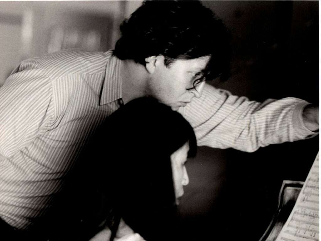 Thomas Ades and Gloria Cheng look at a page of music together